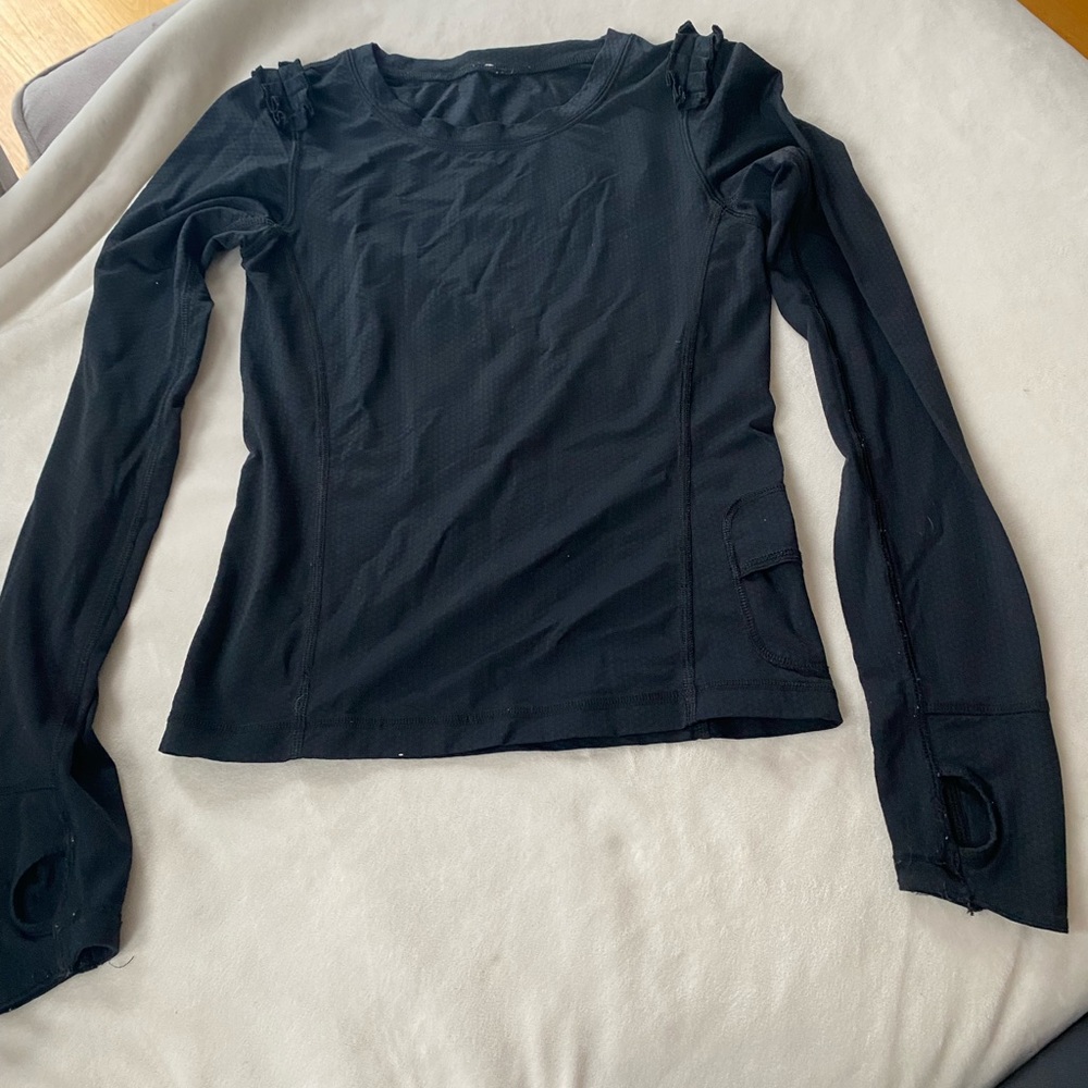 Ivivva (Lululemon brand) black shirt with ruffle detail at shoulder